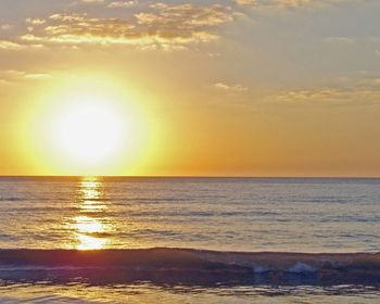 Scenic view of sea against sky at sunset