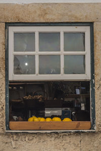 Low angle view of glass window on building