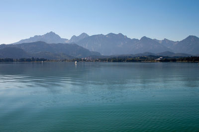 Scenic view of lake against blue sky