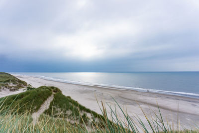 Scenic view of beach against sky