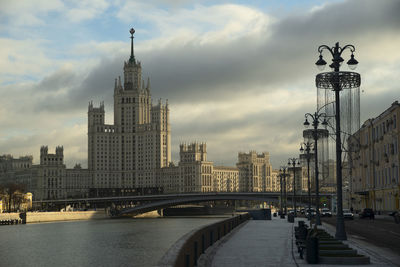 Bridge over river with buildings in background