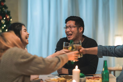 Young man and woman having drink