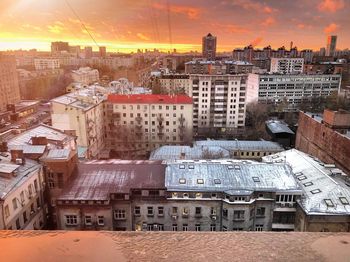 Cityscape against sky during sunset