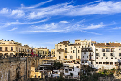 Buildings in city against sky