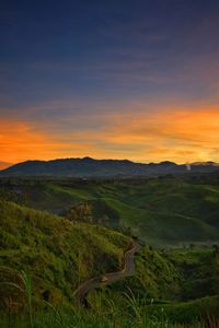 Scenic view of landscape against sky during sunset