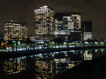 Illuminated buildings in city at night