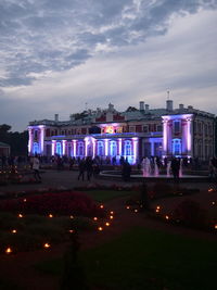 Group of people in front of building at night