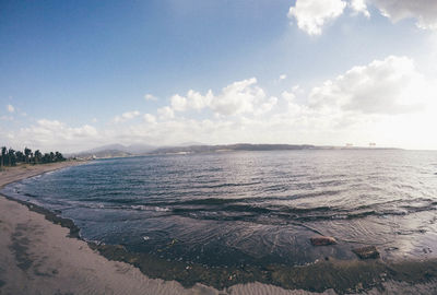 Scenic view of sea against cloudy sky