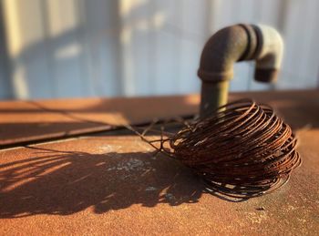 Close-up of rusty metal on table