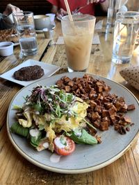 Close-up of an omelette and breakfast potatoes in plate on table