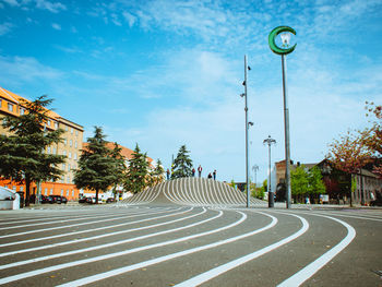 Street light by road against sky