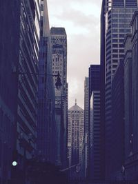 Modern buildings in city against sky