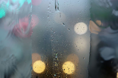 Raindrops on the windshield of the car. focus selected. blur background