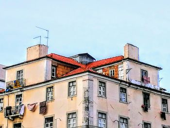 Low angle view of buildings against clear sky