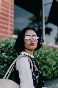 Portrait of a young woman looking away