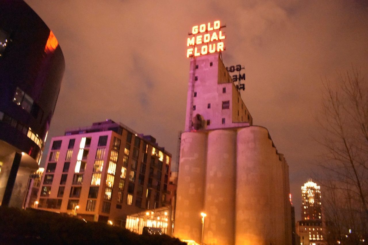 VIEW OF SKYSCRAPERS AT NIGHT