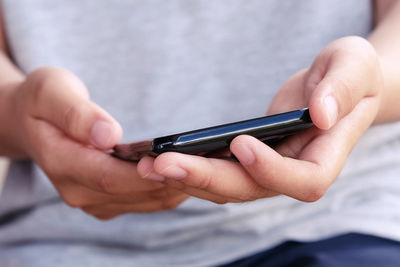 Close-up of man using mobile phone