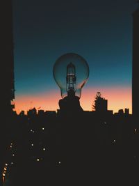 Silhouette of city at dusk