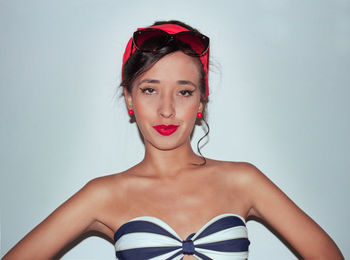 Portrait of a beautiful young woman over white background