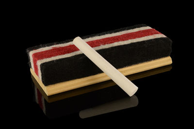 High angle view of open book against black background