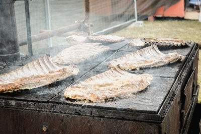 Man preparing meat on barbecue grill