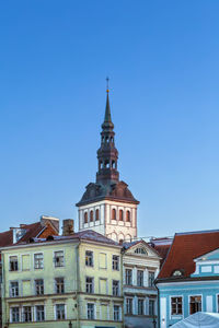 Low angle view of building against clear blue sky