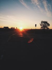 Car on road at sunset