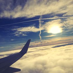 Airplane wing against sky