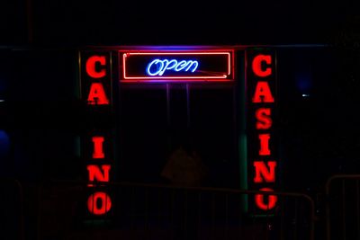 Close-up of information sign at night