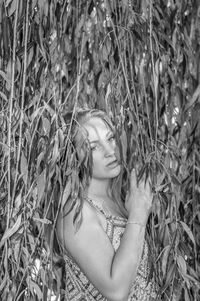 Portrait of young woman in grass