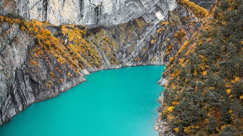 High angle view of rock formations in sea