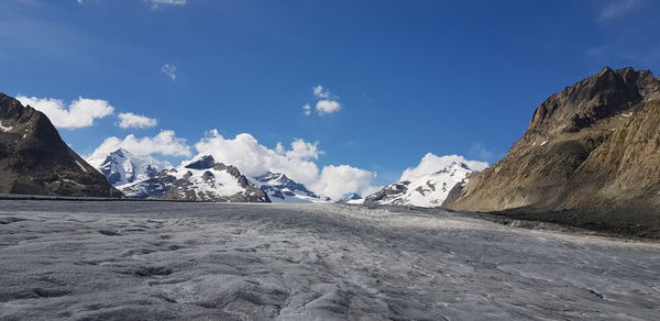 Aletsch glacier in the swiss alps with snowcapped mountains against sky