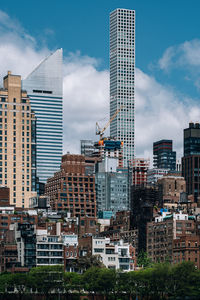 Buildings in city against sky