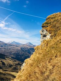 Scenic view of landscape against blue sky