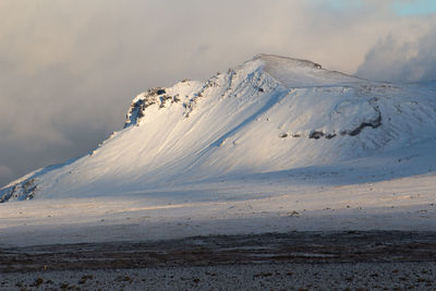 Scenic view of snowcapped mountain against sky