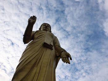 Statue of buddha against sky