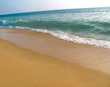 Scenic view of beach against clear sky