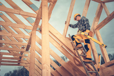 Low angle view of man standing on staircase