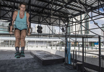 Woman training at rooftop gym in bangkok