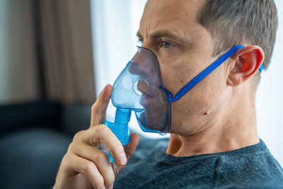 Close-up of man drinking water