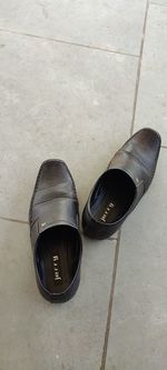High angle view of shoes on footpath