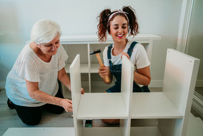 Portrait of a smiling young woman at home