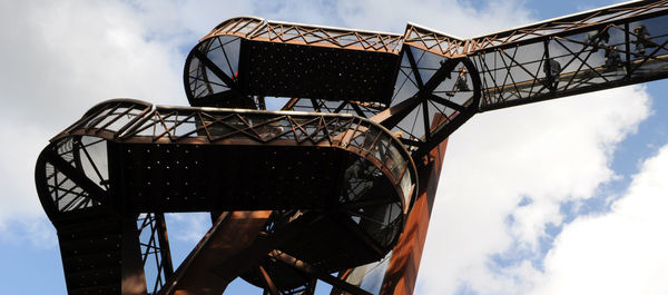 Low angle view of built structure against clouds