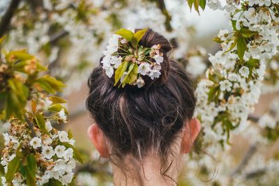 Rear view of woman wearing flowers in hair