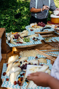 Midsection of man preparing food outdoors