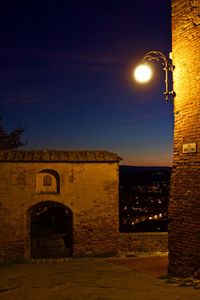 Low angle view of built structure against sky at night