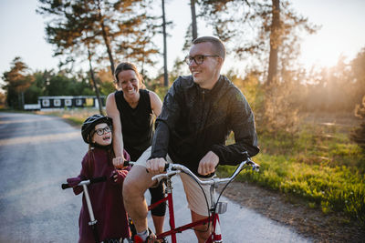 Parents with daughter cycling