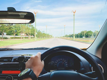 Low section of man driving car