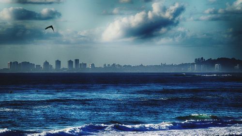 Scenic view of sea against cloudy sky