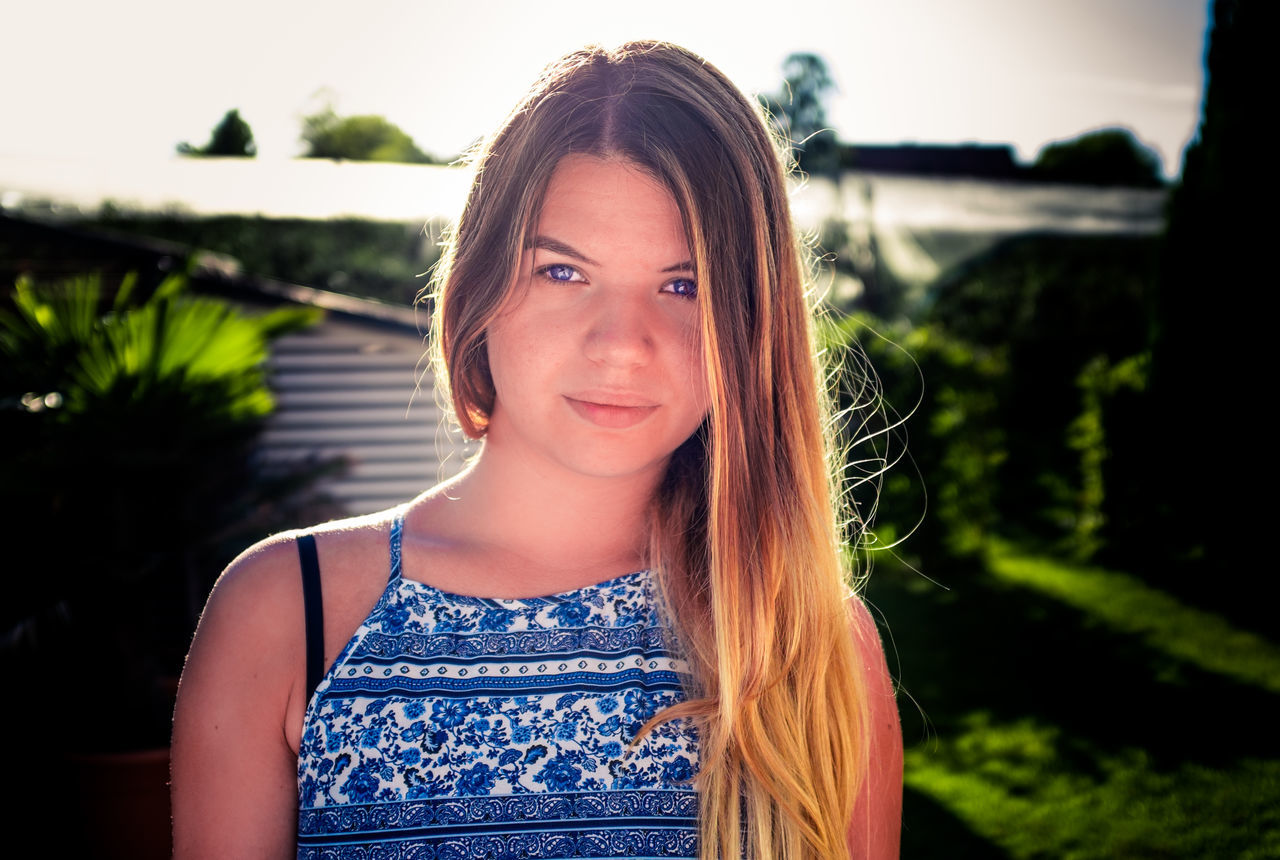 portrait, looking at camera, long hair, smiling, young adult, front view, one person, headshot, confidence, beauty, beautiful woman, young women, outdoors, happiness, one young woman only, people, day, only women, close-up, one woman only, adults only, human body part, adult